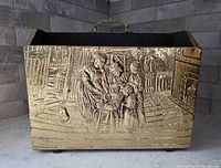 Front view showing embossed Victorian scene and overall form