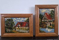 Both framed cross-stitch pieces side by side