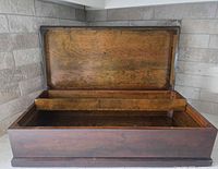 Open trunk showing interior and removable tray