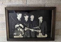 Frontal view of framed Beatles mirror