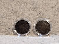 Reverse of both coins showing ONE CENT and dates 1901, 1902 in capsules