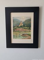 Full view of framed watercolor on wall