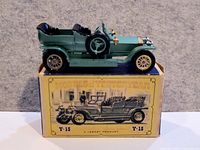 Left side view of green 1907 Rolls-Royce Silver Ghost model on its original box