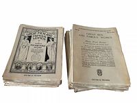 Stacked view of two piles of magazines showing cover design and interior title page