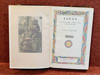 Open book showing illuminated title page and frontispiece