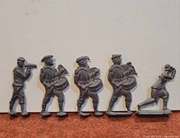 Five pewter soldier figures lined up
