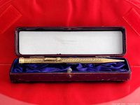 Pencil in open case showing lining and exterior