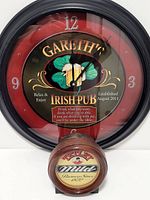 Front of round Gareth’s Irish Pub clock with Tetley plaque below