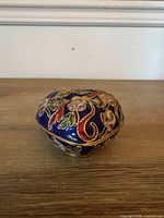 Closed heart-shaped cloisonné box front view