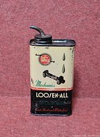 Front view of Whiz Loosen-All oil tin showing graphics and spout
