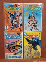 Group shot of four bagged comics showing all covers