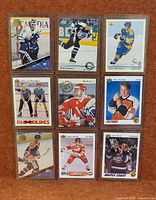 Nine Upper Deck hockey cards in three-by-three arrangement