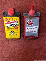 Front view showing both tins and labels