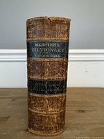 Spine of 1861 Webster’s Dictionary showing title and condition