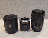 Lens, teleconverter, and case standing upright
