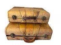 Two stacked tan leather suitcases front view showing latches and handles