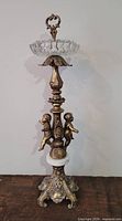 Full view of brass, crystal and marble floor ashtray