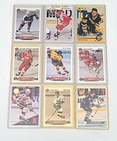 Front view of all nine Classic hockey cards in sleeves