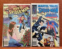 Both comic books front covers in protective sleeves