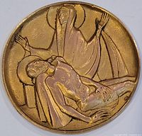 Front view of gold-tone Pietà medallion