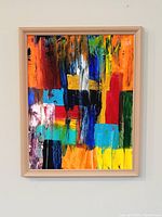 Framed abstract acrylic painting on wall