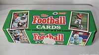 Closed 1991 Topps Football Cards box showing branding and player images