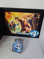 Front view of lithograph with sealed pins bag