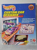 Front of sealed Hot Wheels Custom Car Designer CD-ROM box showing contents and branding