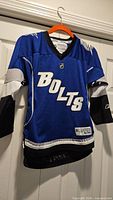 Front view of blue Tampa Bay Lightning Reebok youth jersey