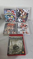 All five PlayStation 3 game cases arranged for full cover visibility