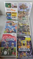 Six Wii game cases front view