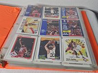 Binder page showing 9 NBA Hoops cards featuring Bulls players and All-Star subset with Johnson, Bird, Barkley