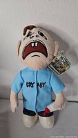 Front view of Mijos Cry Baby plush showing overall appearance and tag