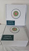 Two unopened branded Dippin' Donutz kit boxes stacked