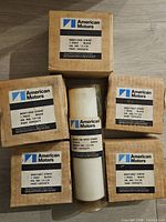 five boxed stripe rolls and one wrapped stripe roll