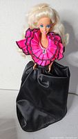 Barbie Night Sensation doll in pink ruffle top and black skirt