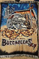 Full view of woven Buccaneers tapestry showing graphics and fringe