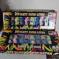 Two sealed boxes of Boxco parrot patio string lights