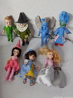 Group shot showing seven Wizard of Oz dolls