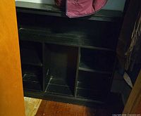 Front view showing three vertical compartments and shelves