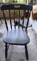 Front view of painted Windsor chair showing seat motif