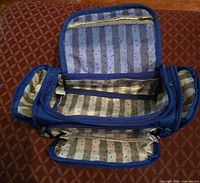 Interior view showing multiple zip compartments and lining