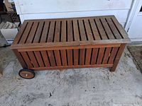 Front view showing slatted panels and wheels