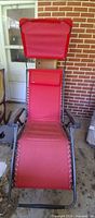 Front view of red zero gravity chair with canopy