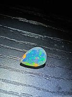 Pear-cut opal showing pinfire colour play