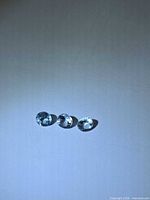 Three round aquamarine gemstones front view