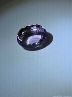 Top view of faceted oval purple amethyst