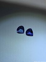 Two pear-cut tanzanite stones face-up