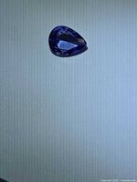 Pear-cut deep blue tanzanite face-up view