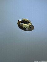Top view of oval golden yellow heliodor gemstone